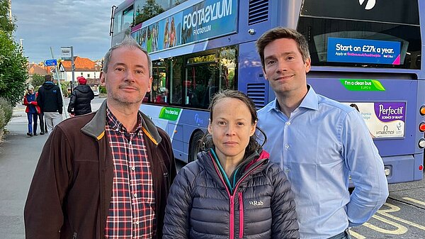 Stephen Williams, Caroline Gooch and Nick Coombes with a local bus